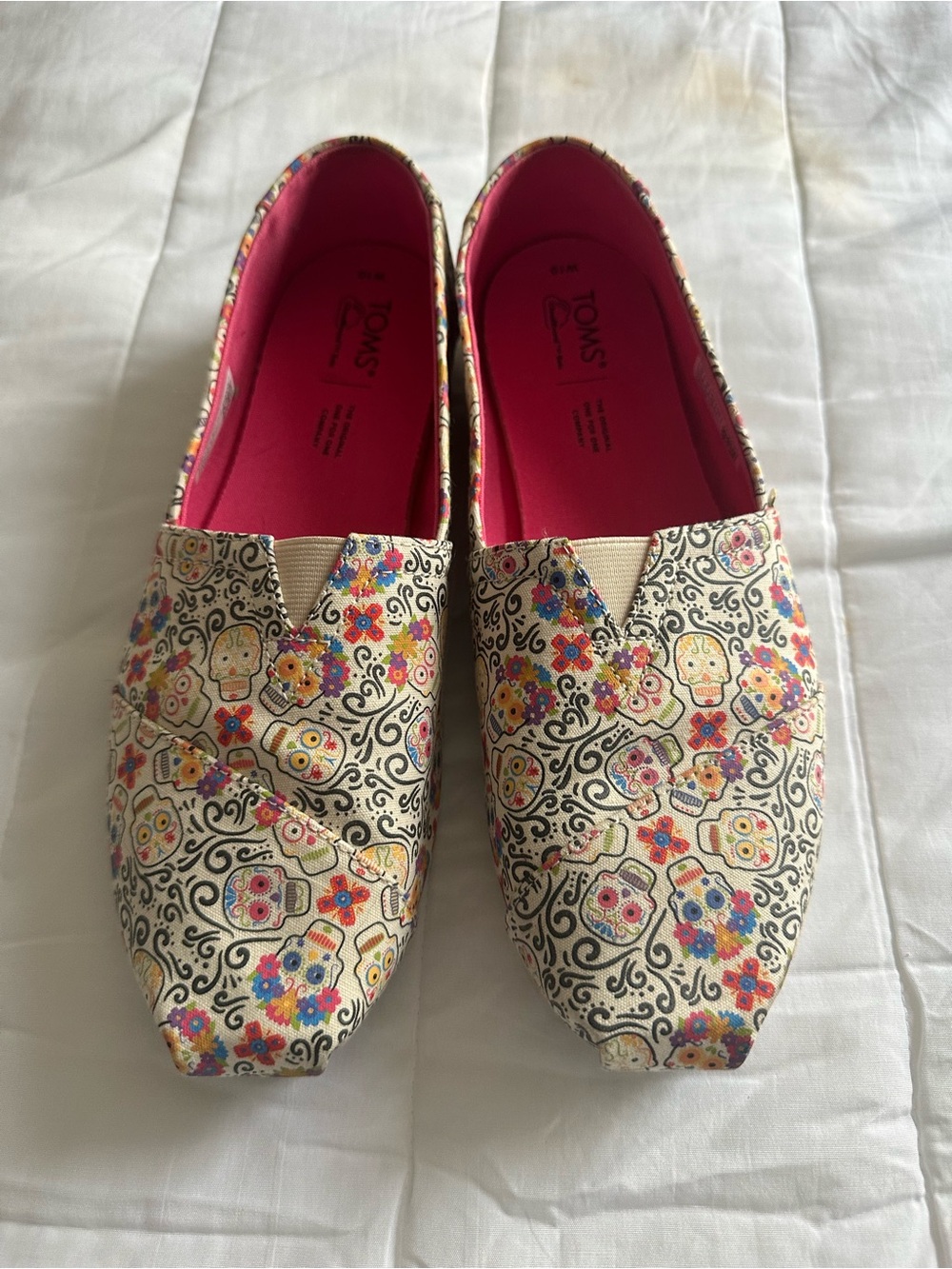 TOMS Cream Canvas Slip-Ons with Pink Insole and Colorful Sugar Skull Print